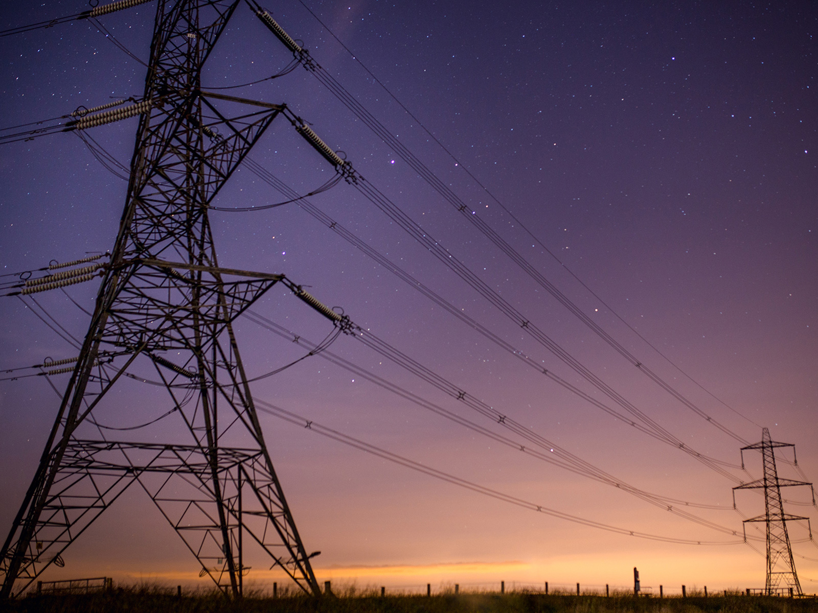 Transmission towers at dusk