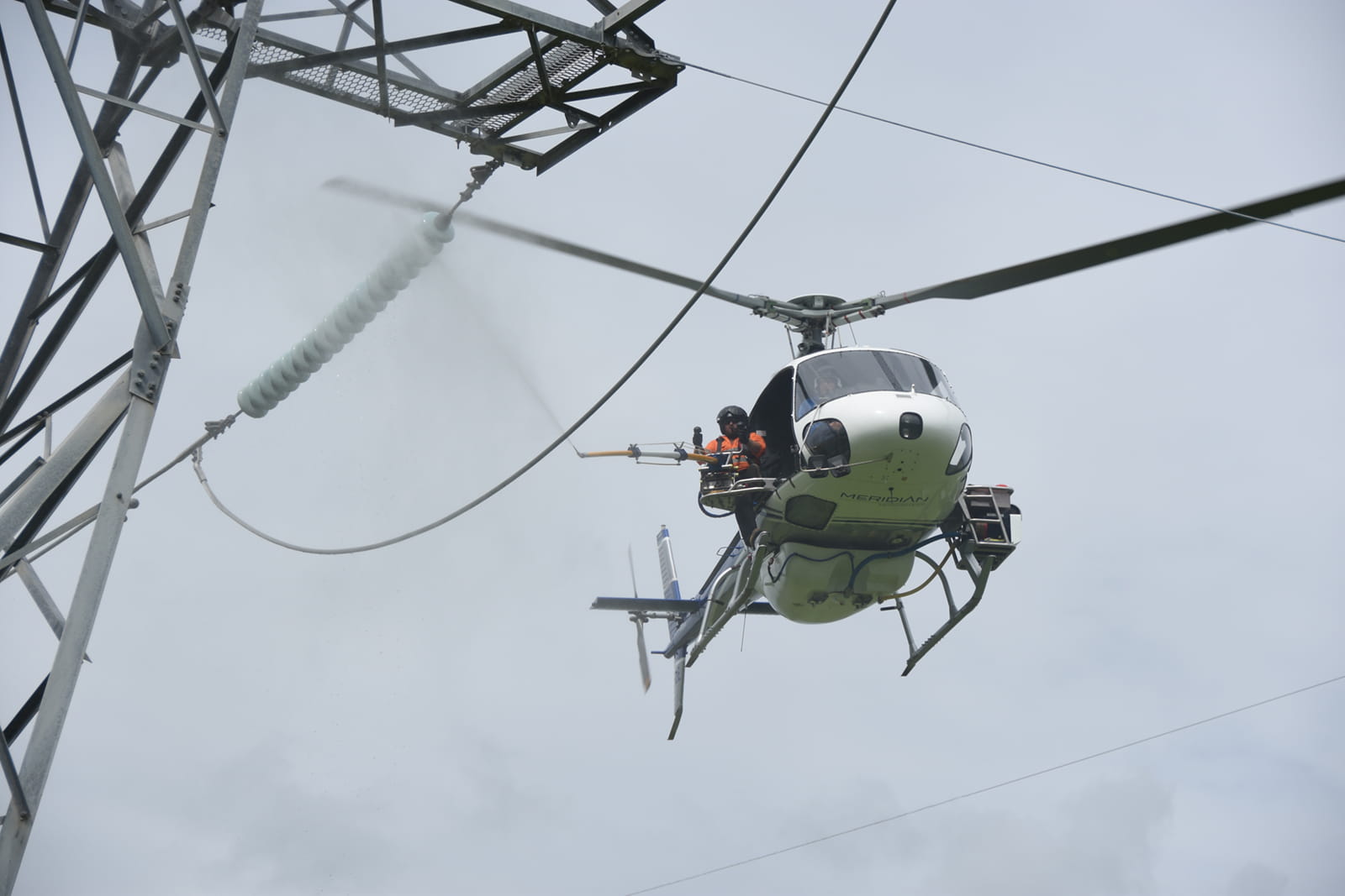 Helicopter cleaning transmission towers in Queensland